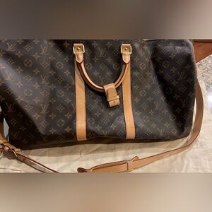 Louie Vuitton Duffle Bag excellent condition. With dust bag.